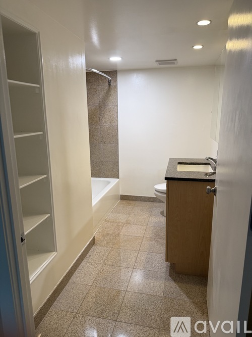 A bathroom with a toilet and a sink.
