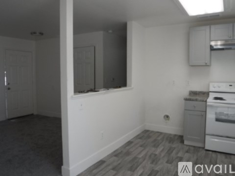 A kitchen area with a stove top oven and a dishwasher.