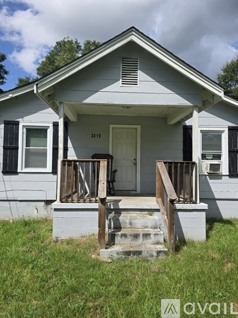 A house with the number 3019 on the front door.
