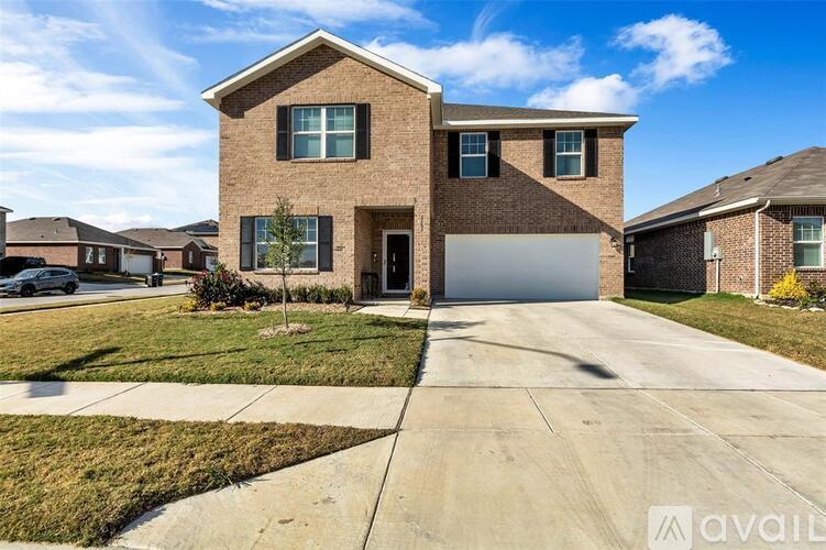 A house with a driveway in front of it.