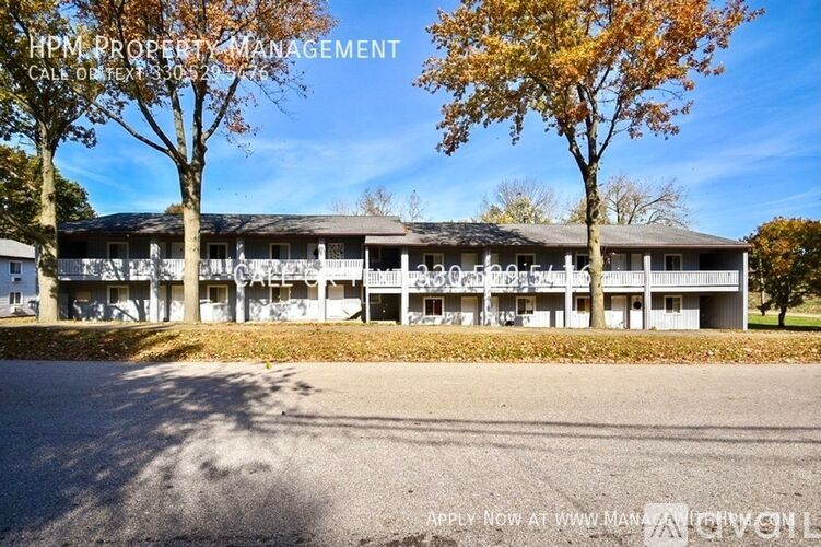 A building with the text "HPM PROPERTY MANAGEMENT CALL OF EXISTENCE" on the top left corner.