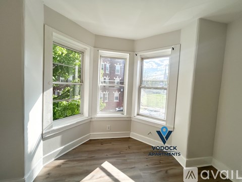 A room with a Vodock Apartments logo on the wall.