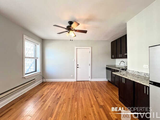 A BEALPROPERTIES sign is on a kitchen counter.
