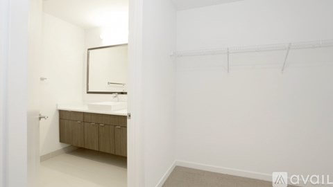 A bathroom with a sink and a mirror.