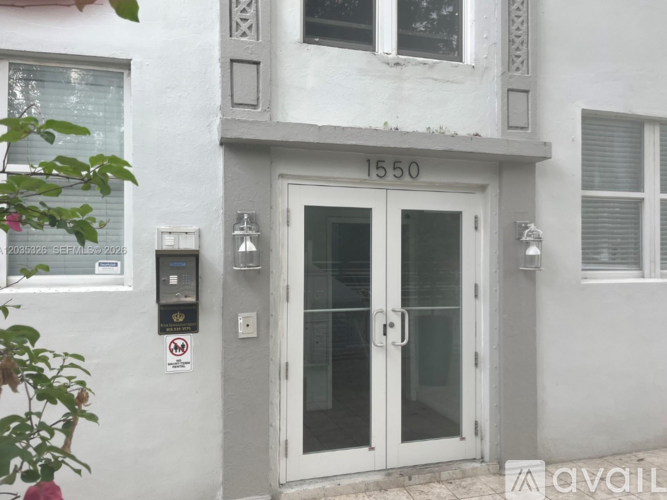 The front door of a building with the number 1550 on it.