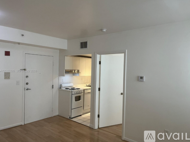 A kitchen area with a stove and an oven.