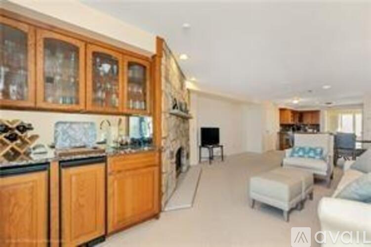 A kitchen with wooden cabinets and a white countertop.