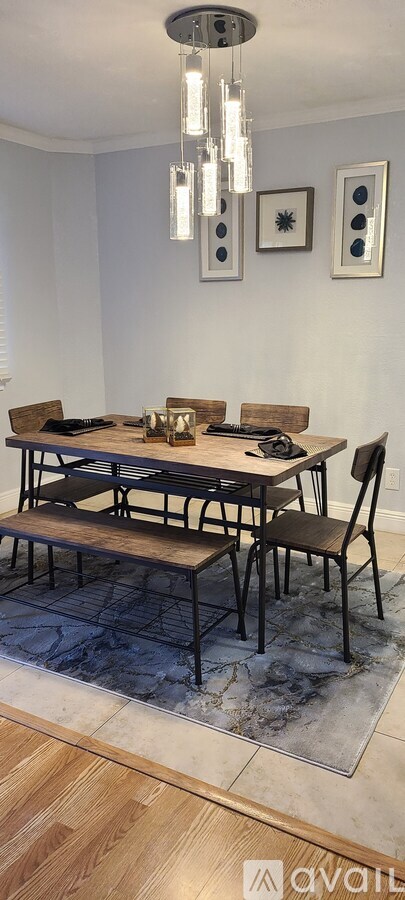 A modern dining room with a wooden table and chairs.