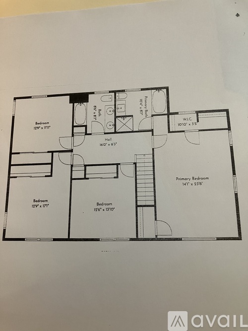 A drawing of a house floor plan with a primary bedroom and two other bedrooms.