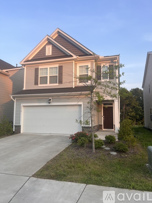 A house with a garage and a driveway.