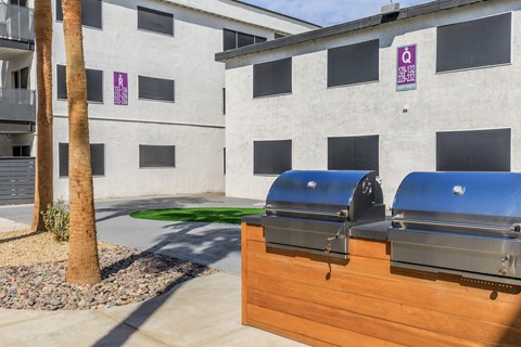 A building with a purple sign on it.