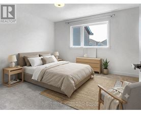 A bedroom with a large bed, a nightstand, and a window with a view of the roof of a house.