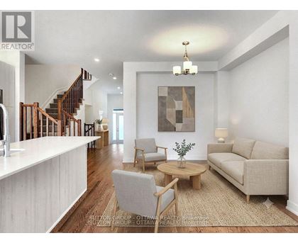 A living room with a couch, chair, and coffee table.