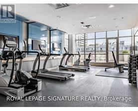 A gym with treadmills and a sign that says Royal LePage Signature Realty, Brokerage.