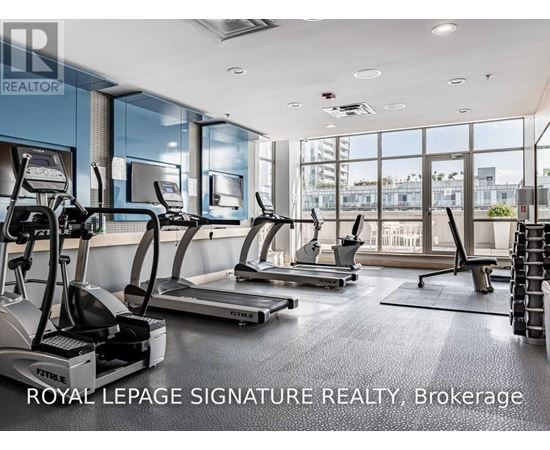 A gym with treadmills and a sign that says Royal LePage Signature Realty, Brokerage.