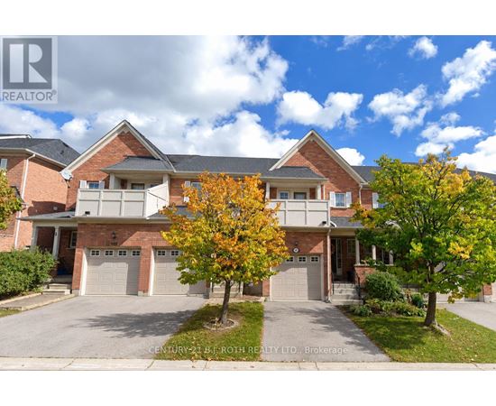 A large house with a tree in front of it.