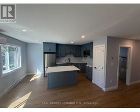 A kitchen with a large island in the middle of the room.
