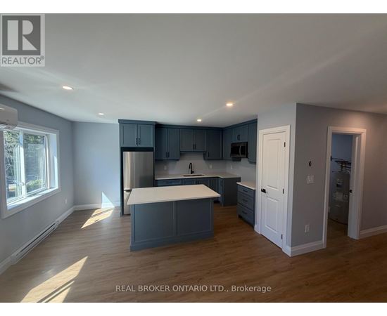 A kitchen with a large island in the middle of the room.