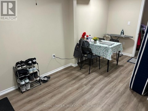 A room with a table and chairs and a rack of shoes.