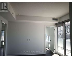 A room with a Real One Realty Inc. logo on the wall.
