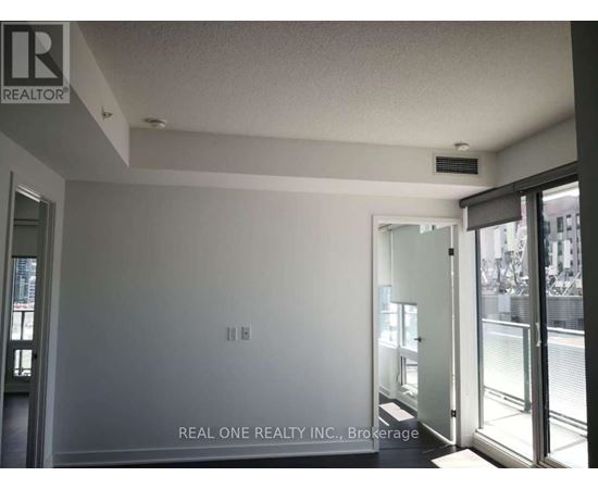A room with a Real One Realty Inc. logo on the wall.