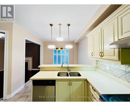 A kitchen with a sink and cabinets.