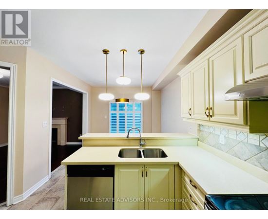 A kitchen with a sink and cabinets.