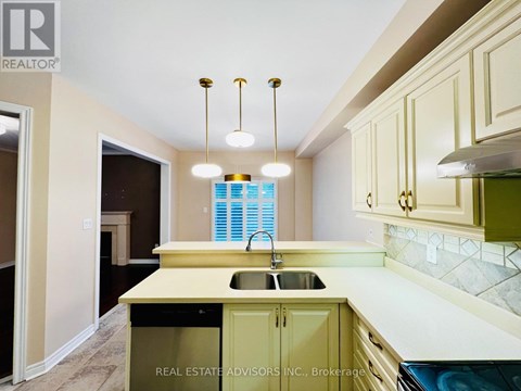 A kitchen with a sink and cabinets.