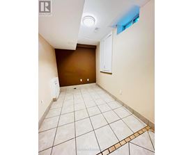 A room with brown walls and white tile flooring.