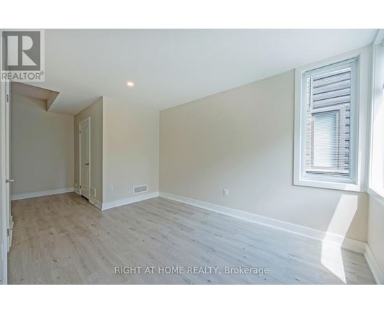 A room with a window and a door in it.