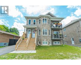 A large house with a balcony and a deck is for sale.