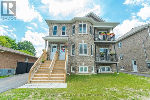 A large house with a balcony and a deck is for sale.
