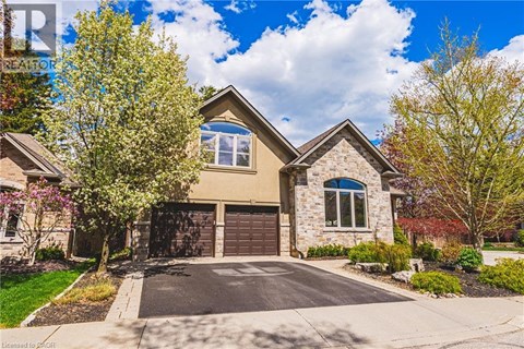 A house with a driveway and a garage door.
