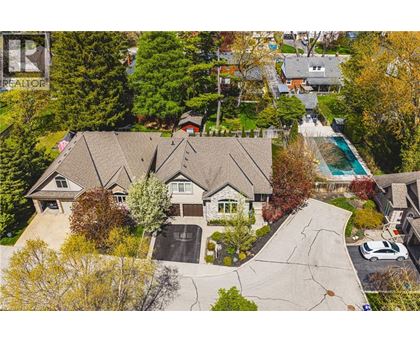 A large house with a pool in the backyard.