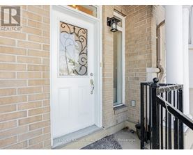 A white door with a glass window and a metal handle.