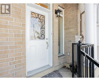 A white door with a glass window and a metal handle.