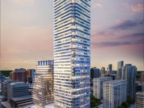 A tall, modern skyscraper stands in the center of a cityscape.