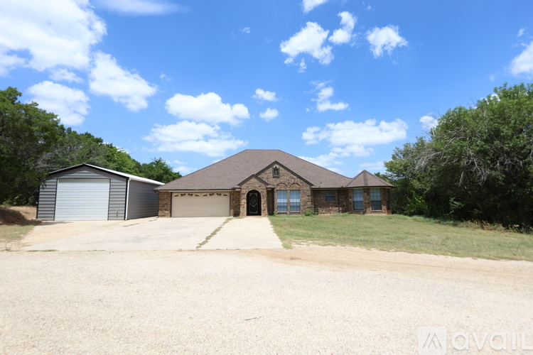 A house with a driveway in front of it.