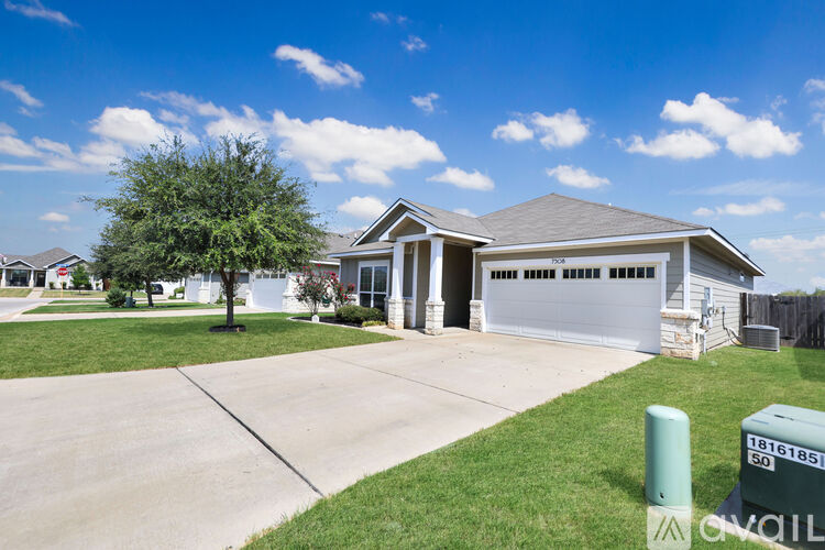 A house with a garage is for sale.