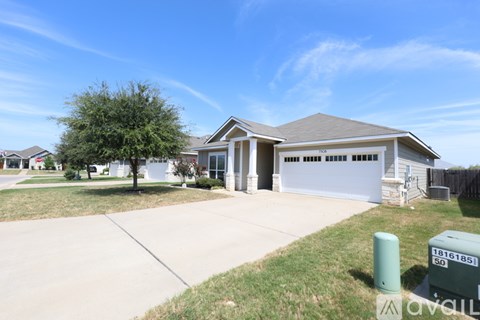 A house with a garage is for sale.