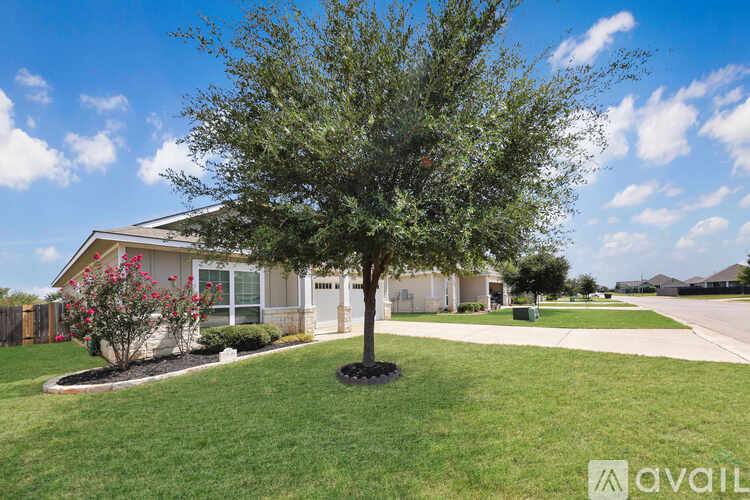 A house with a tree in front of it.
