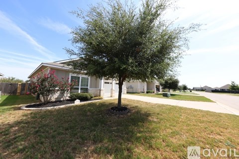 A house with a tree in front of it.