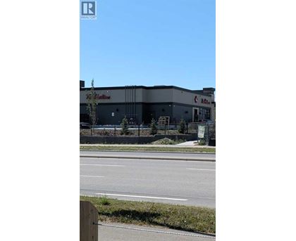 A building with a red sign that says "REALTY" on it.