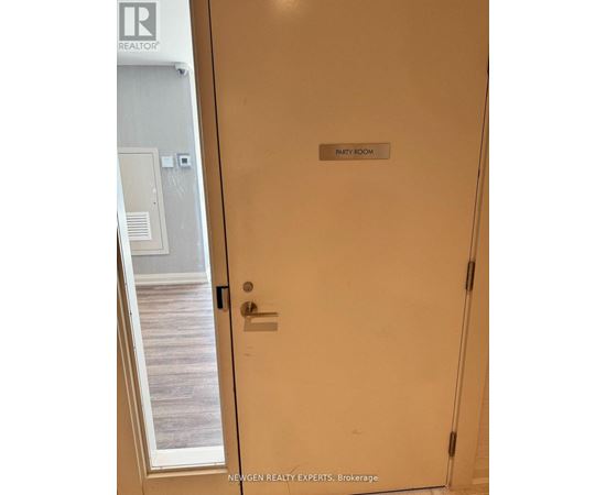 A white door with a sign that says "Party Room".