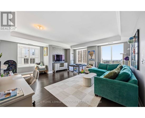 A living room with a green couch and a white coffee table.