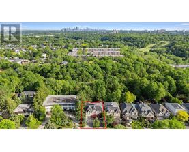 A bird's eye view of a residential area with a red square highlighting a specific house.