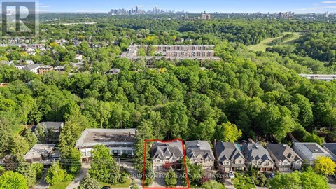 A bird's eye view of a residential area with a red square highlighting a specific house.