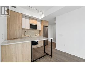 A kitchen with wooden cabinets and a white countertop.
