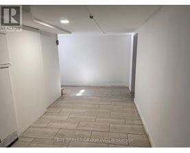 A room with a tiled floor and white walls.