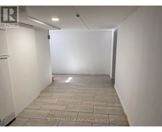 A room with a tiled floor and white walls.